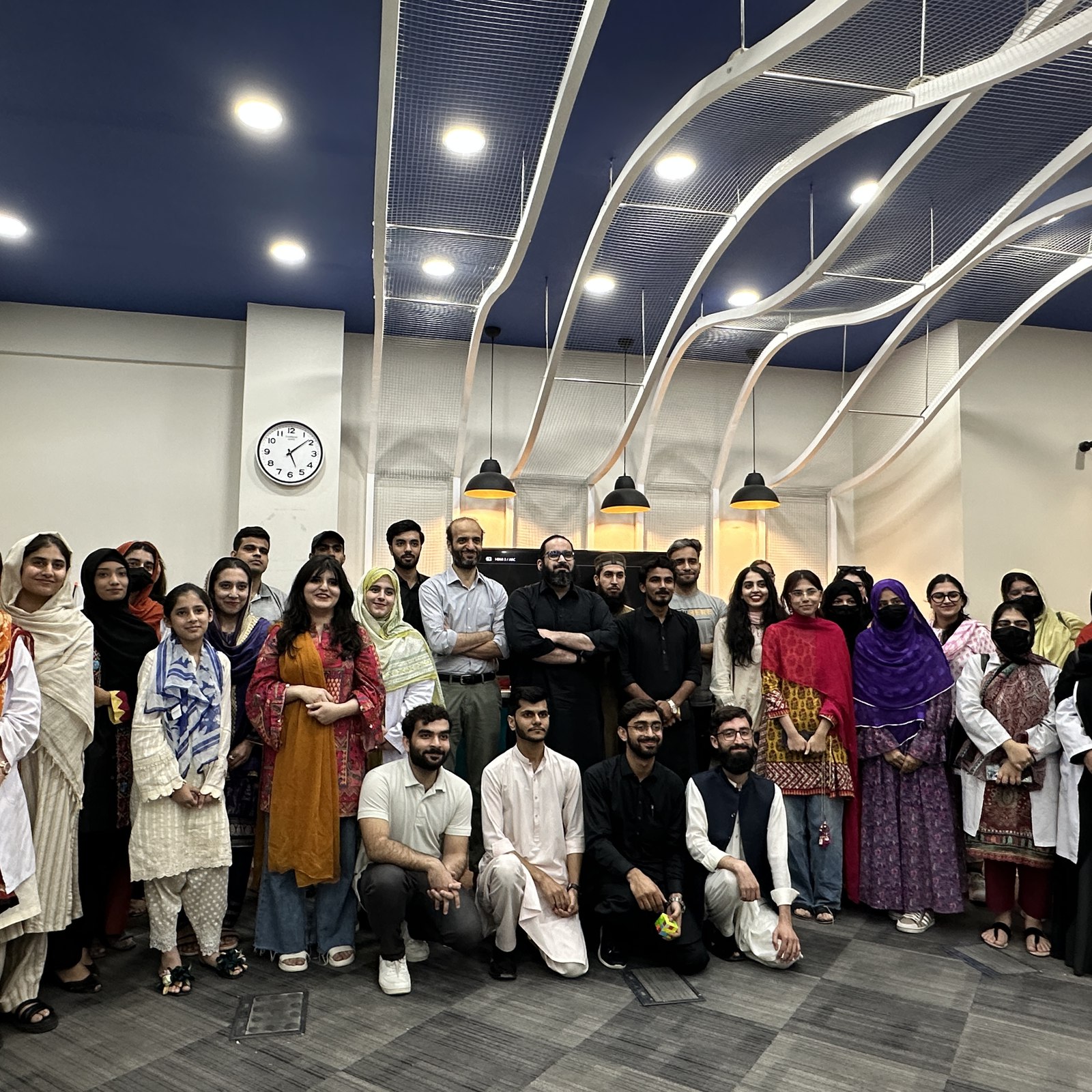 The full group of participants, scientists, and facilitators posing together at the end of the workshop.